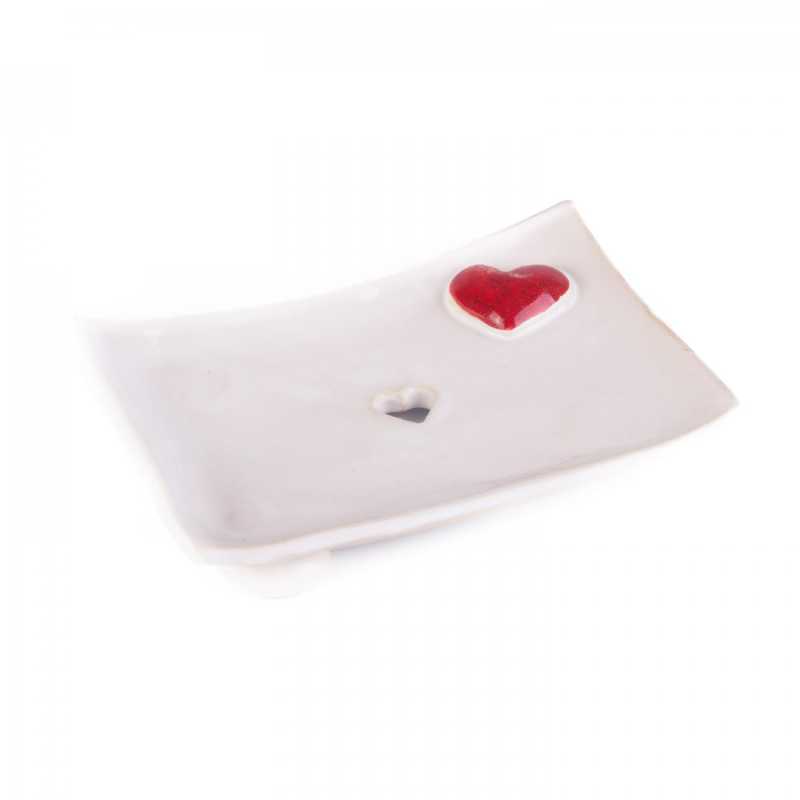 Soap dish on legs, with a heart-shaped hole for water drainage. Decorated with relief.
100% handmade: modelled, embossed, painted, glazed. Ceramic soap dish fr