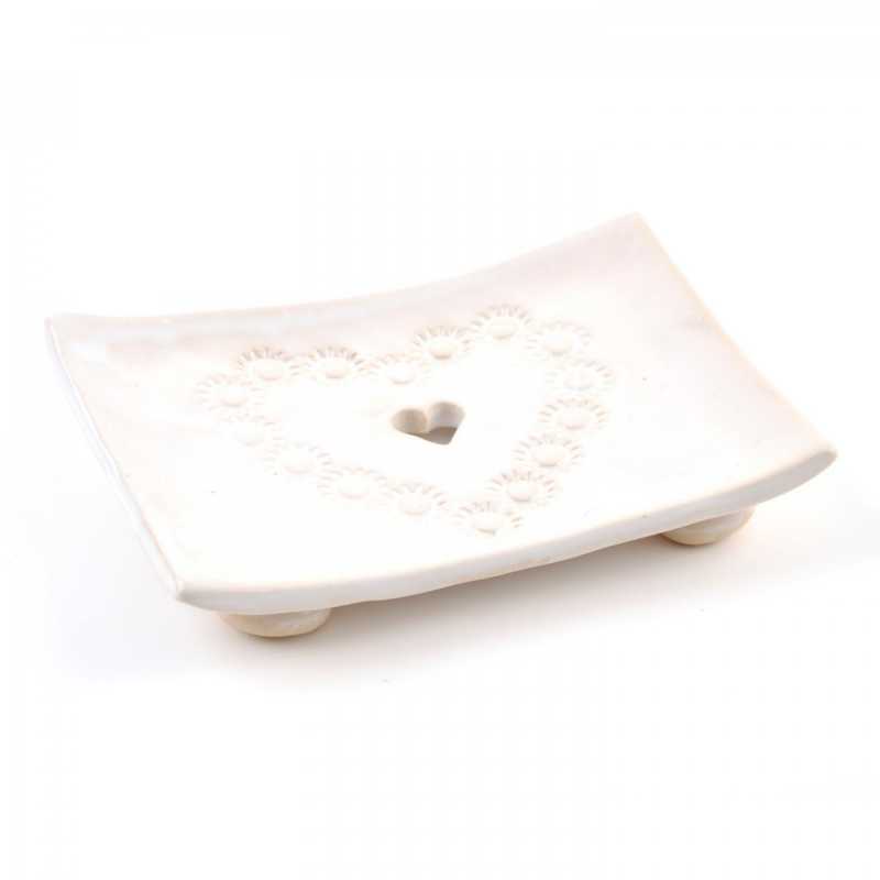 Soap dish on legs, with a heart-shaped hole for water drainage. Decorated with relief.
100% handmade: modelled, embossed, painted, glazed. Ceramic soap dish fr