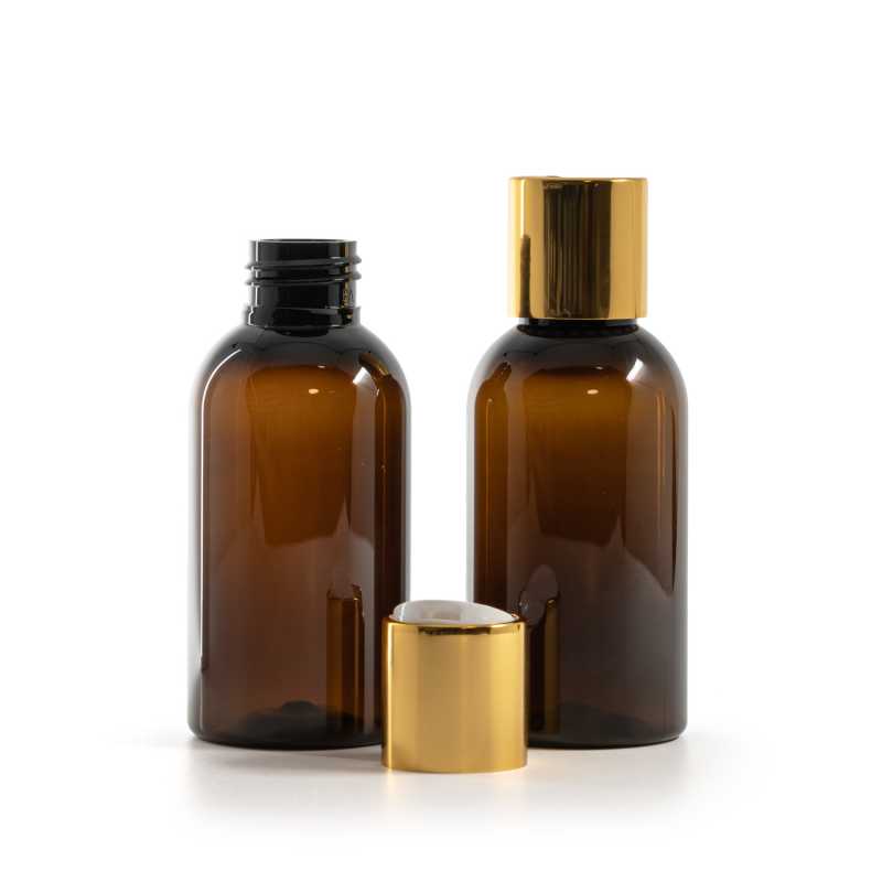 Amber Plastic Bottle, White Plastic Flip Top With Golden Aluminum Collar, 100 ml