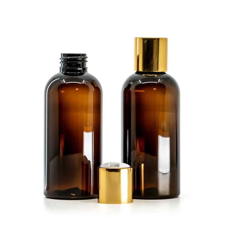 Amber Plastic Bottle, White Plastic Flip Top With Golden Aluminum Collar, 150 ml