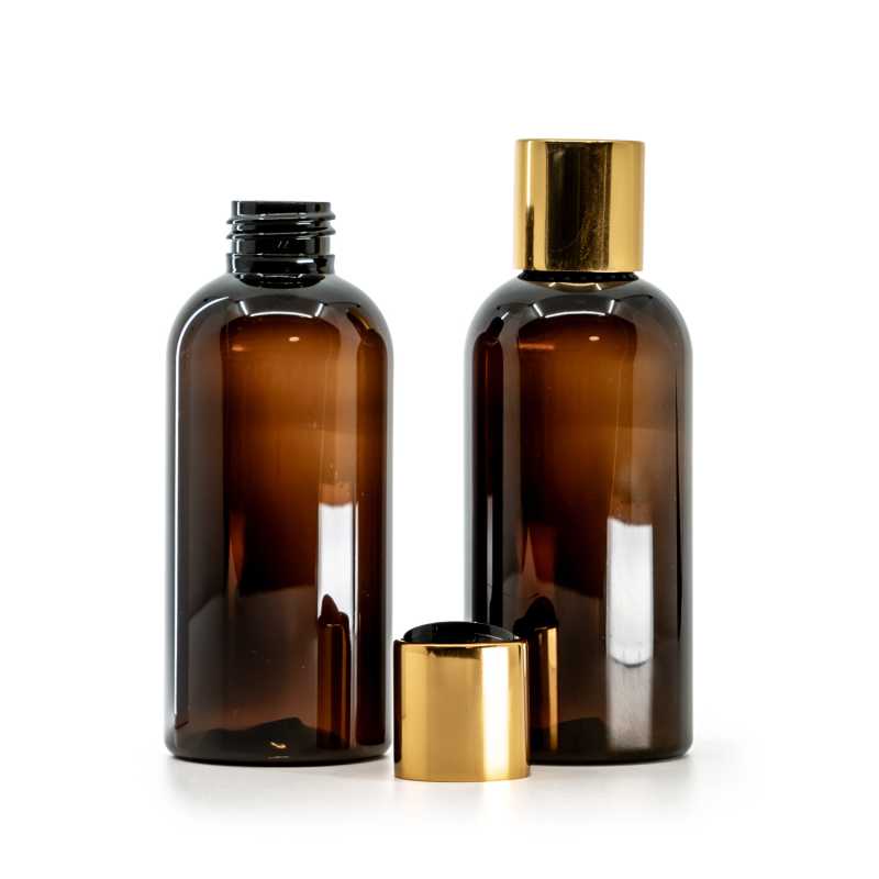 Amber Plastic Bottle, Black Plastic Flip Top With Golden Aluminum Collar, 150 ml