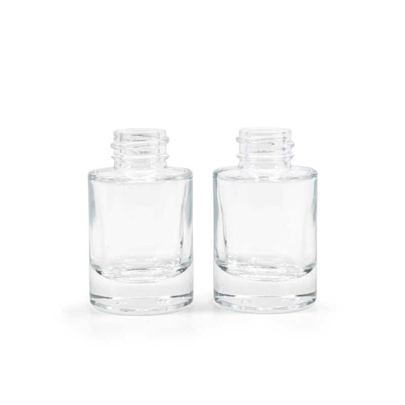 The glass bottle is made of thick transparent glass with a thick bottom. It is used for storing liquids.Volume: 10 ml, total volume 15 mlBottle height: 52,6 mmB