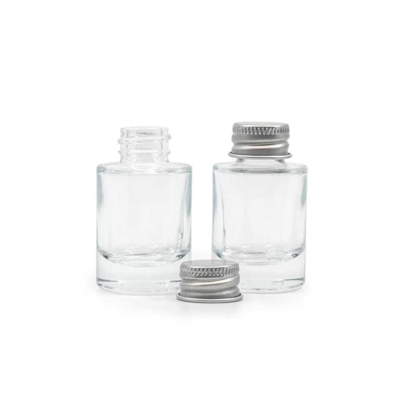 The glass bottle is made of thick transparent glass with a thick bottom. It is used for storing liquids.Volume: 10 ml, total volume 15 mlBottle height: 52,6 mmB