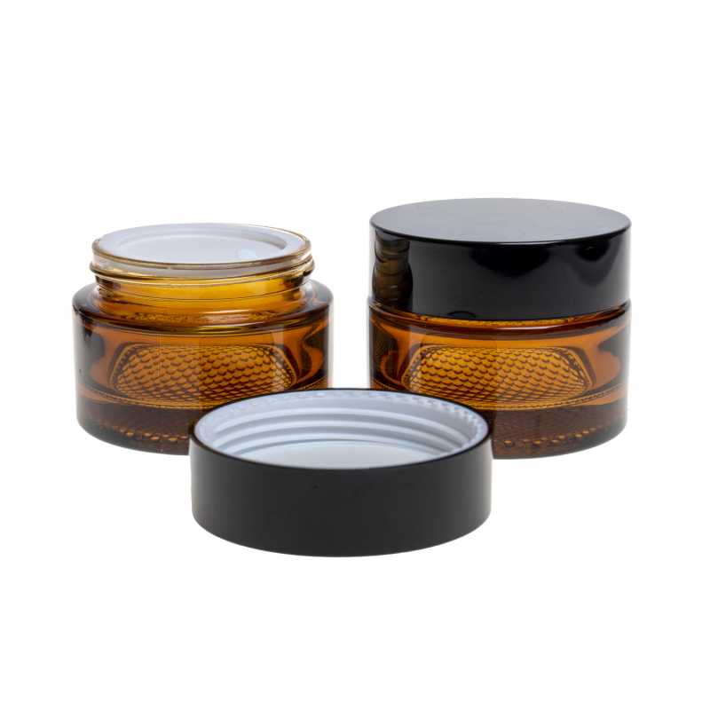 Elegant glass tumbler made of thick brown glass with a volume of 50 ml. Suitable for storing creams, balms, oils or samples. The diameter of the lid is 6,4 cm.H