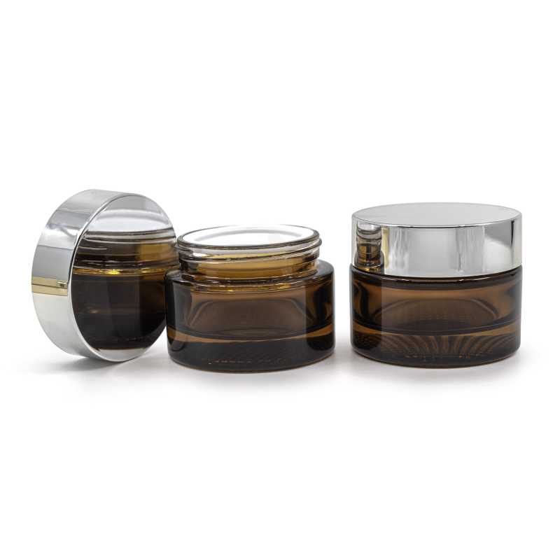 Elegant glass tumbler made of thick brown glass with a volume of 50 ml. Suitable for storing creams, balms, oils or samples. The diameter of the lid is 6,4 cm.H